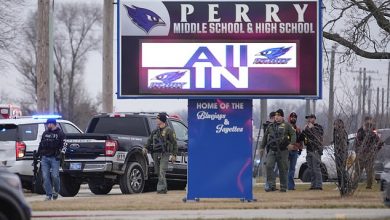 Perry High School shooter injures two Iowa students and an administrator on first day back from winter break before turning the gun on themself